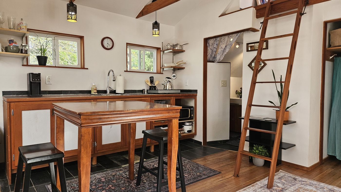 Kitchenette with stovetop and open shelving